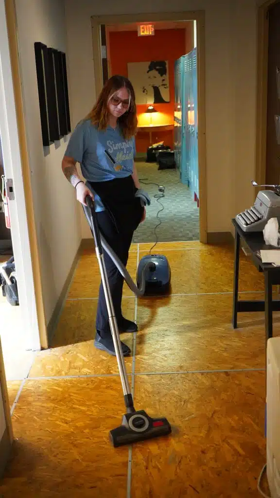 Simply Maid Sparkle Technician vacuuming