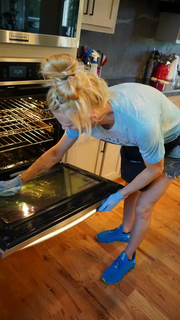 Simply Maid Sparkle Technician cleaning a kitchen